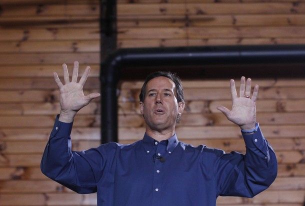 image of Rick Santorum holding his hands up: 'Republican presidential candidate and former Senator Rick Santorum speaks during a campaign stop at Merrimack Valley Railroad in Northfield, New Hampshire January 5, 2012. [Reuters Pictures]'
