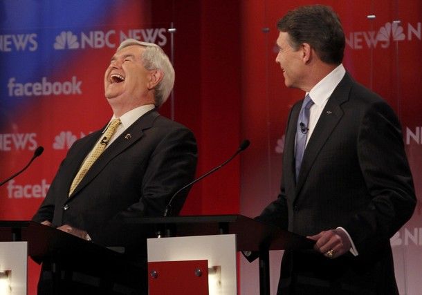 Newt Gingrich throwing his head back and laughing