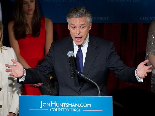 image of Jon Huntsman at a podium yelling with his mouth open and his arms out