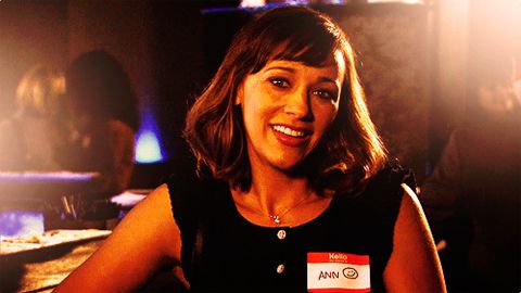 image of Rashida Jones as Ann Perkins, at a bar wearing a nametag labeled Ann followed by a smiley face