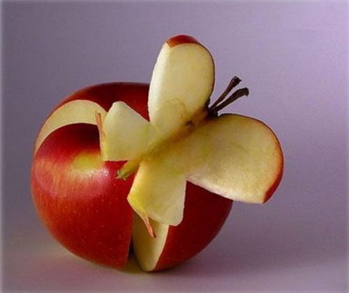 image of an apple sculpture featuring a butterfly