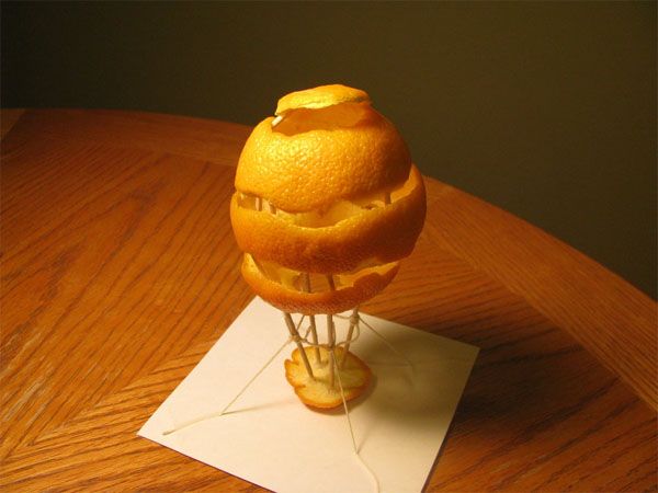 picture of an orange peel carved into a hot air balloon