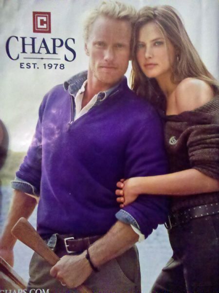 advert for Chaps menswear, featuring a kyriarchetypical straight couple, the dude half of which is holding an oar in such a position that it mimics a huge hard-on