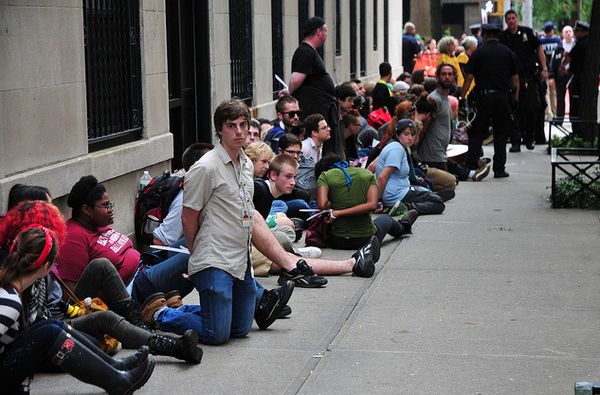 image of arrested protesters lined up against a wall in NYC