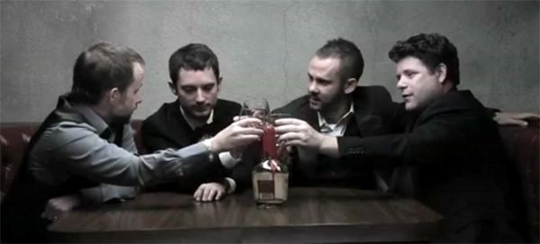 image of Billy Boyd, Elijah Wood, Dominic Monaghan, and Sean Astin having a drink