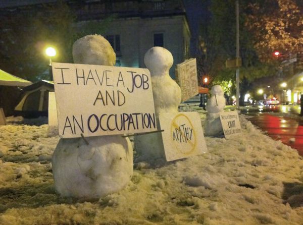 image of snowpeople holding signs reading 'I have a job and an occupation' and 'no apathy' at Occupy Lancaster County