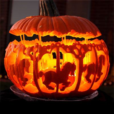 image of a pumpkin carved into a carousel