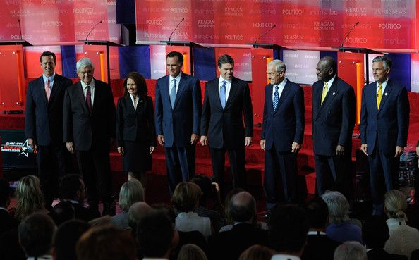 image of Republican candidates standing in a line in virtually identical suits