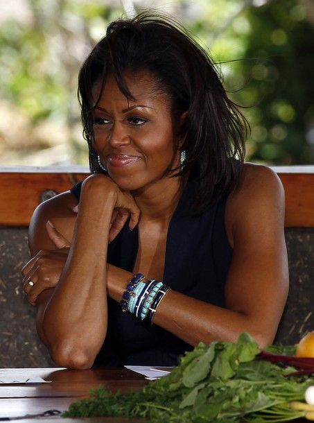 U.S. first lady Michelle Obama listens during a roundtable with interns after touring the Ma'o Organic Farms in Waianae, Hawaii November 12, 2011. [Reuters Pictures]