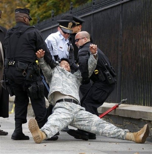 image of Choi being dragged down the street after his arrest