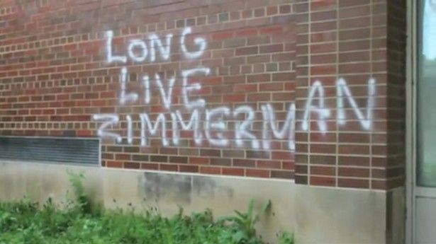 image of a brick facade spray-painted with 'Long Live Zimmerman'