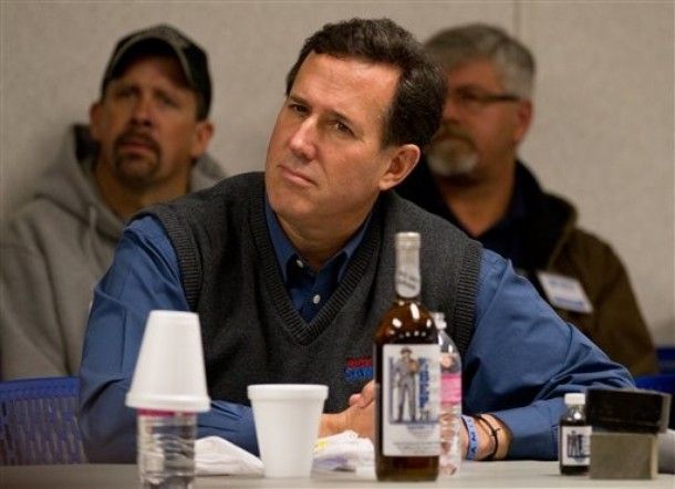 Image of Mitt Romey with a 'zuh' look on his face: 'Republican presidential candidate, former Pennsylvania Sen. Rick Santorum meets with business leaders, Wednesday, Feb. 15, 2012, in Tioga, N.D. [AP Photo]'