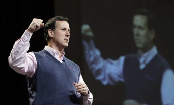 image of Rick Santorum with his fist raised at a campaign event