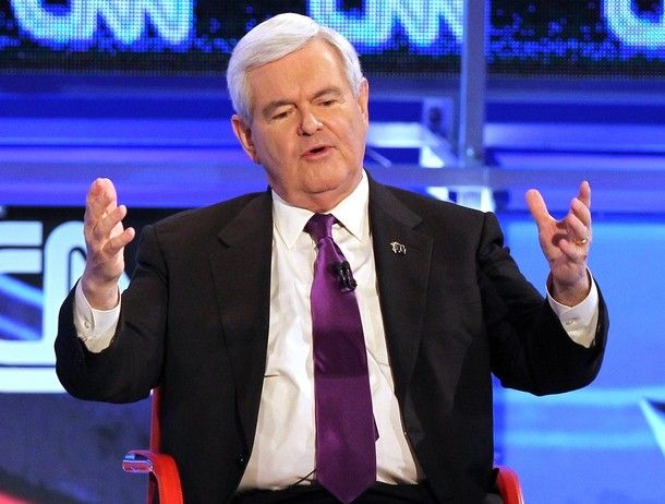 Newt Gingrich with his arms raised