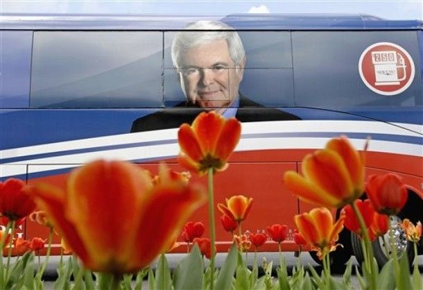image of Newt Gingrich's campaign bus with his face on the side, and blooming flowers below