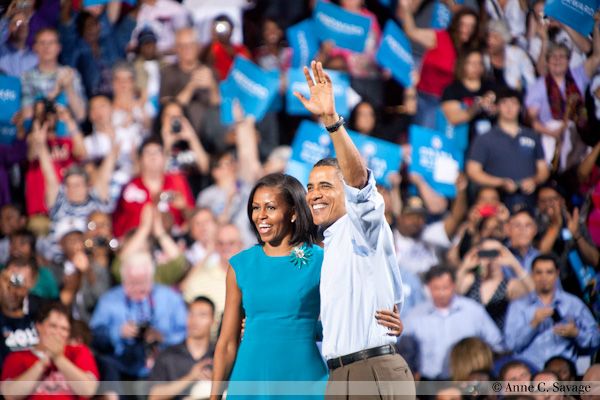 image of President Barack Obama and First Lady Michelle Obama at a campaign rally, in front of a huge crowd