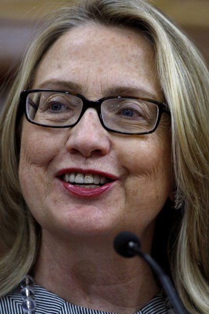 extreme close-up image of Hillary Clinton wearing glasses and no make-up