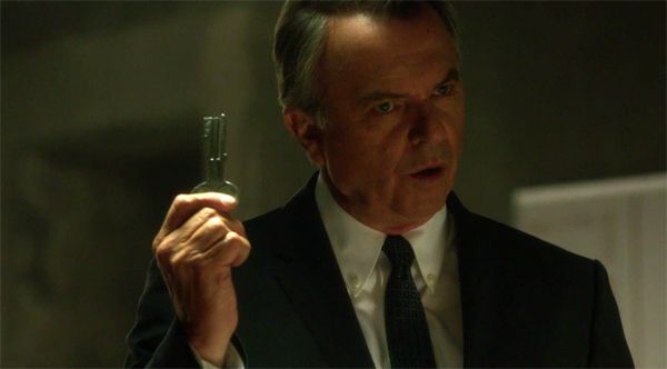 image of Sam Neill holding up a key from the most recent episode of Alcatraz