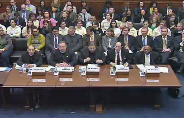 photo of hearing; all the people ready to testify are men