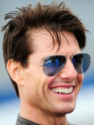 Tom Cruise grinning and wearing sunglasses