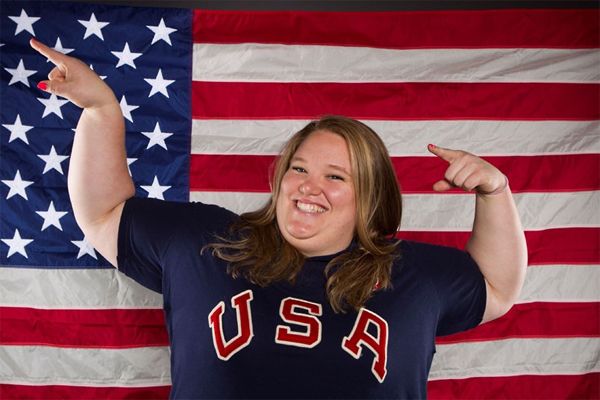 image of a fat white woman posing in front of a US flag