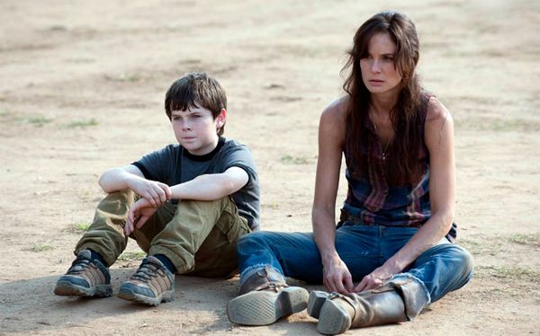 image of Lori and Carl sitting on the ground looking defeated, from the last episode of The Walking Dead