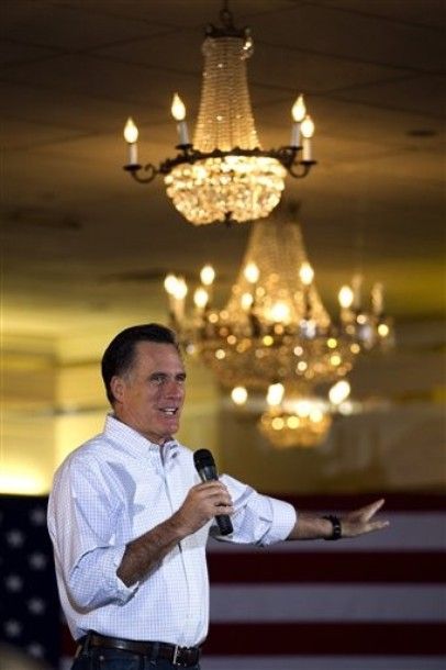image of Mitt Romney standing under some chandeliers