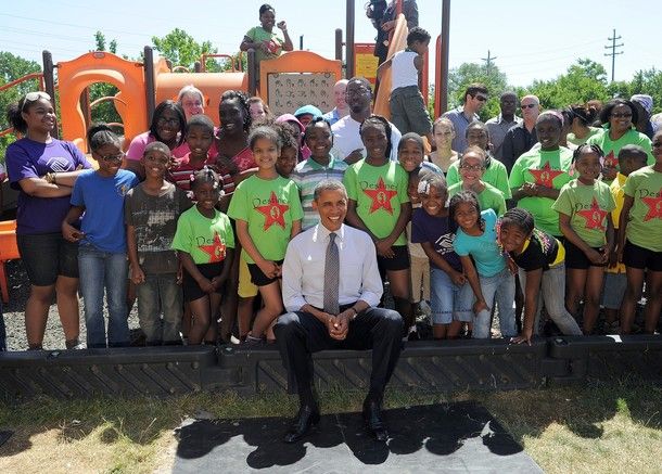 President Obama poses with a large group of children outside the Boys and Girls Club of Cleveland