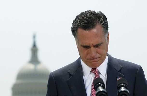 image of Mitt Romney in front of the Capitol, hanging his head