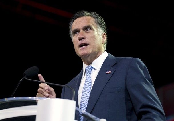 image of Mitt Romney standing a podium pointing his finger and looking stern