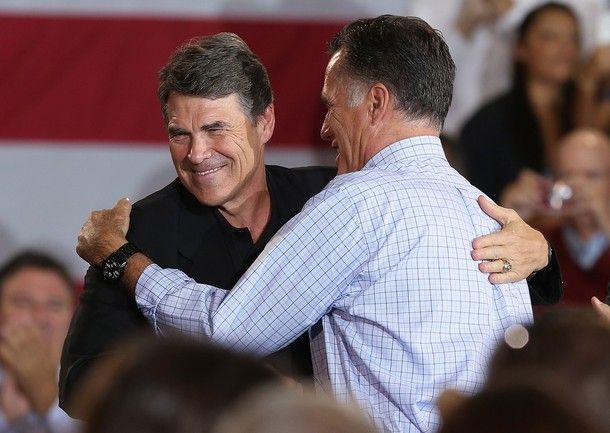 image of Mitt Romney and Texas Governor Rick Perry awkwardly hugging