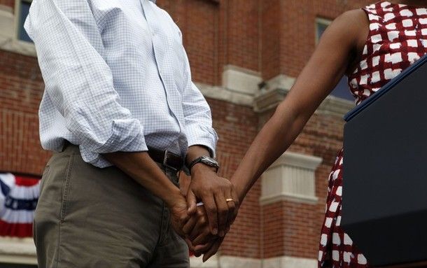 image of the President's and First Lady's hands, held as the First Lady speaks