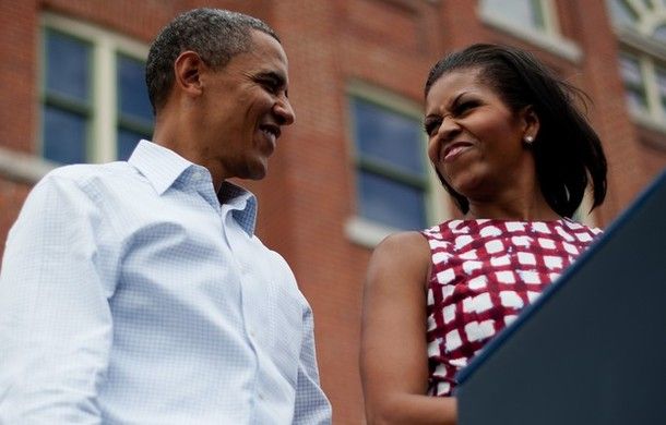 image of President and First Lady Obama making cute faces at each other onstage