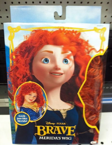 image of a red wig in a Brave-branded box labeled 'Merida's wig' and featuring an image of a little girl sporting the wig and positioned in a weirdly come-hither chin-down pose, labeled 'Look just like Merida!' although Merida is posed with her chin-up and averted gaze