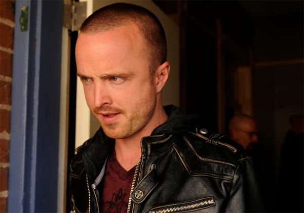 image of Jesse (Aaron Paul) looking troubled, while Walt (Bryan Cranston) is visible over his shoulder in the background