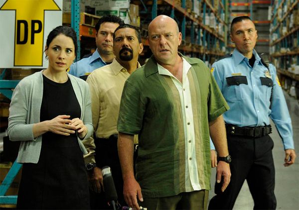 image of Hank (Dean Norris) and his DEA team at a warehouse