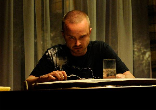 image of Jesse sitting at Walt's dining room table eating dinner and looking super anxious