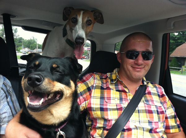 image of GoldFisjy in the backseat with Zelda and Dudley, who are both grinning