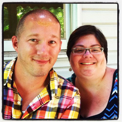 image of GoldFishy, a handsome white man in his 40s, and Liss, sitting on the back porch at Shakes Manor