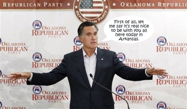 image of Mitt Romney standing at a podium in front of a backdrop with Oklahoma Republicans logos all over it, to which I have added a dialogue bubble reading: 'First of all, let me say it's real nice to be with you all here today in Arkansas.'