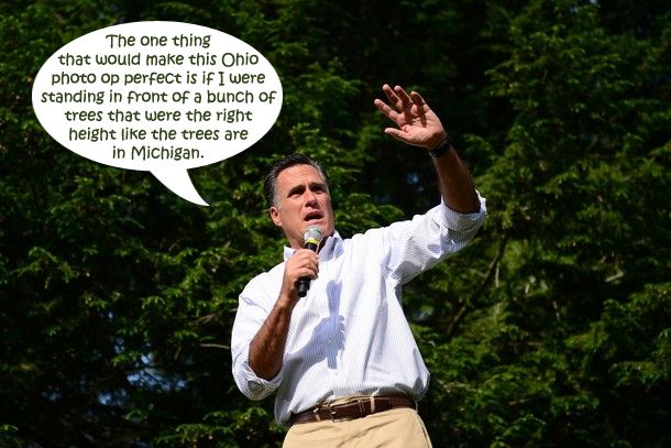 Mitt Romney at a campaign appearance in Pennsylvania, standing in front of a bunch of trees, to which I have added a dialogue bubble reading: 'The one thing that would make this Ohio photo op perfect is if I were standing in front of a bunch of trees that were the right height like the trees are in Michigan.'