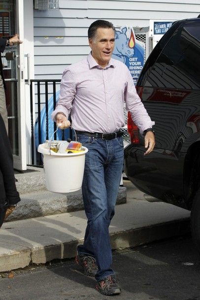 image of Mitt Romney carrying a plastic bucket full of some random crap outside a hardware store