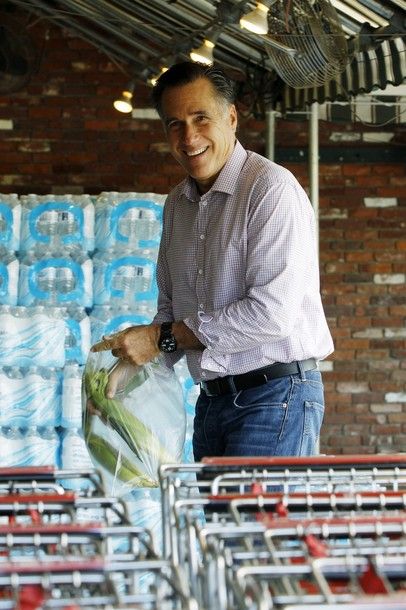 image of Mitt Romney at a grocery store, putting ears of corn in a bag and grinning