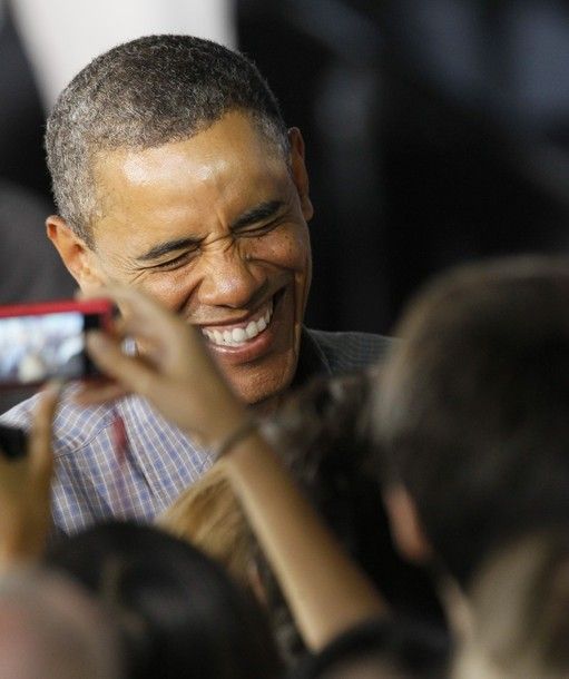 image of President Barack Obama in a crowd, laughing, on the campaign trail