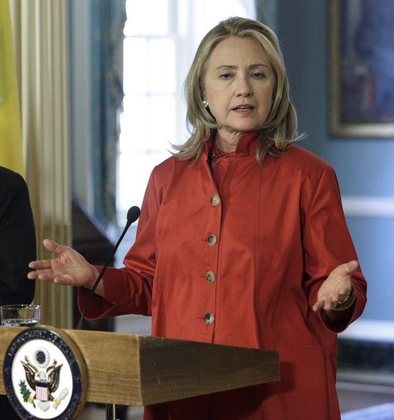 image of Hillary Clinton holding out her hands and making a curious and slightly miffed expression