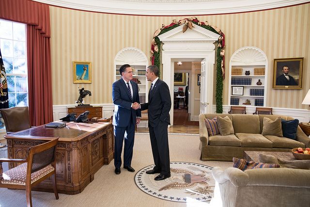 image of the whole bodies of the two men standing with the rest of the room now visible