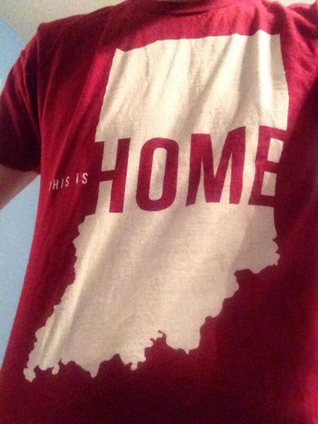 image of a thin white man wearing a red t-shirt with the outline of the state of Indiana and text reading 'This is HOME'