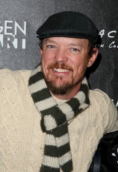 image of actor Matthew Lillard, a young white man wearing a newsboy cap and a scarf