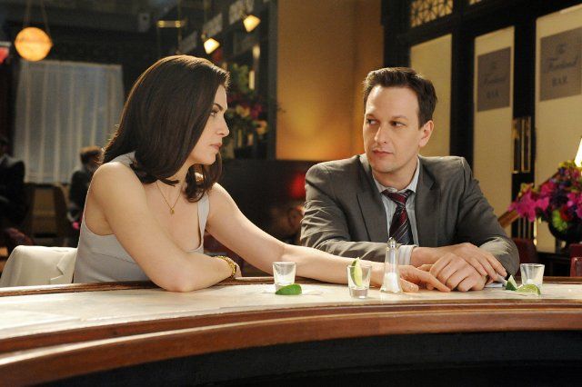 image of Julianna Margulies as Alicia and Josh Charles as Will, sitting at a bar in an episode of The Good Wife