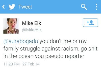 screen cap of Tweet from Mike Elk reading @aurabogado you don’t me or my family’s struggle against racism go shit in the ocean you pseudo reporter.